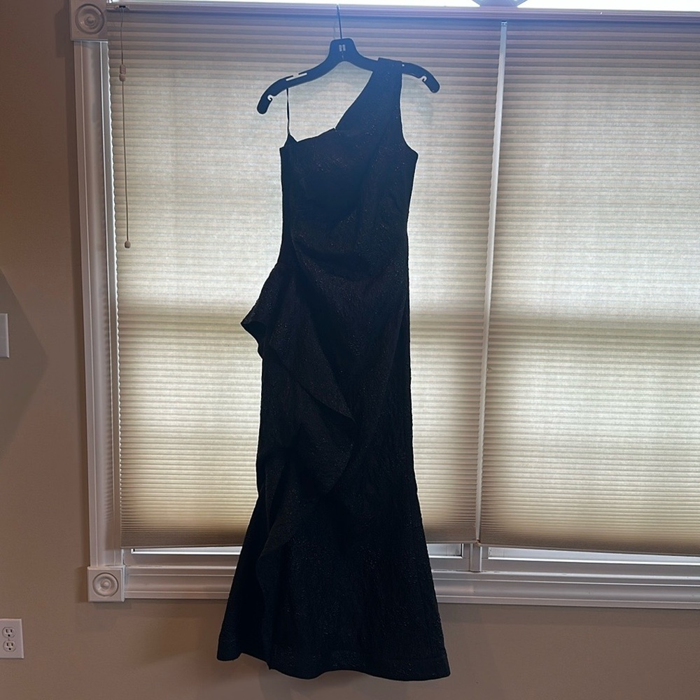 Long black one shoulder formal dress.  Worn once. Dry cleaned.